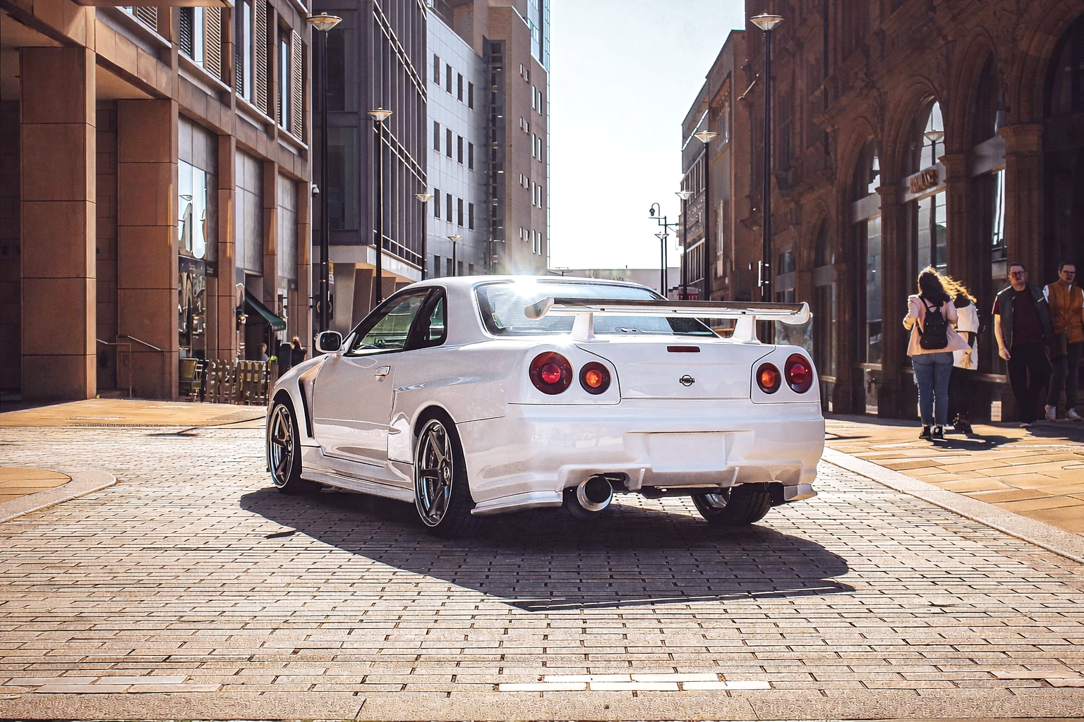 Nissan Skyline R34 city rear sunlight